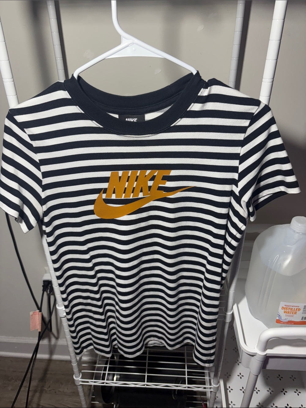 Nike Black & White Striped Tee with Gold Logo